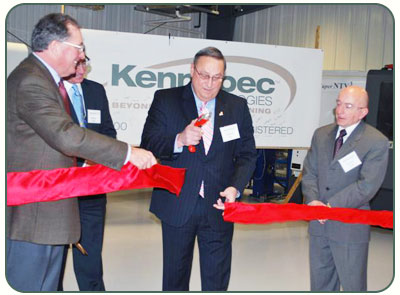 Photo of Governor LePage cutting the ribbon to commemorate Kennebec Technologies' expansion
